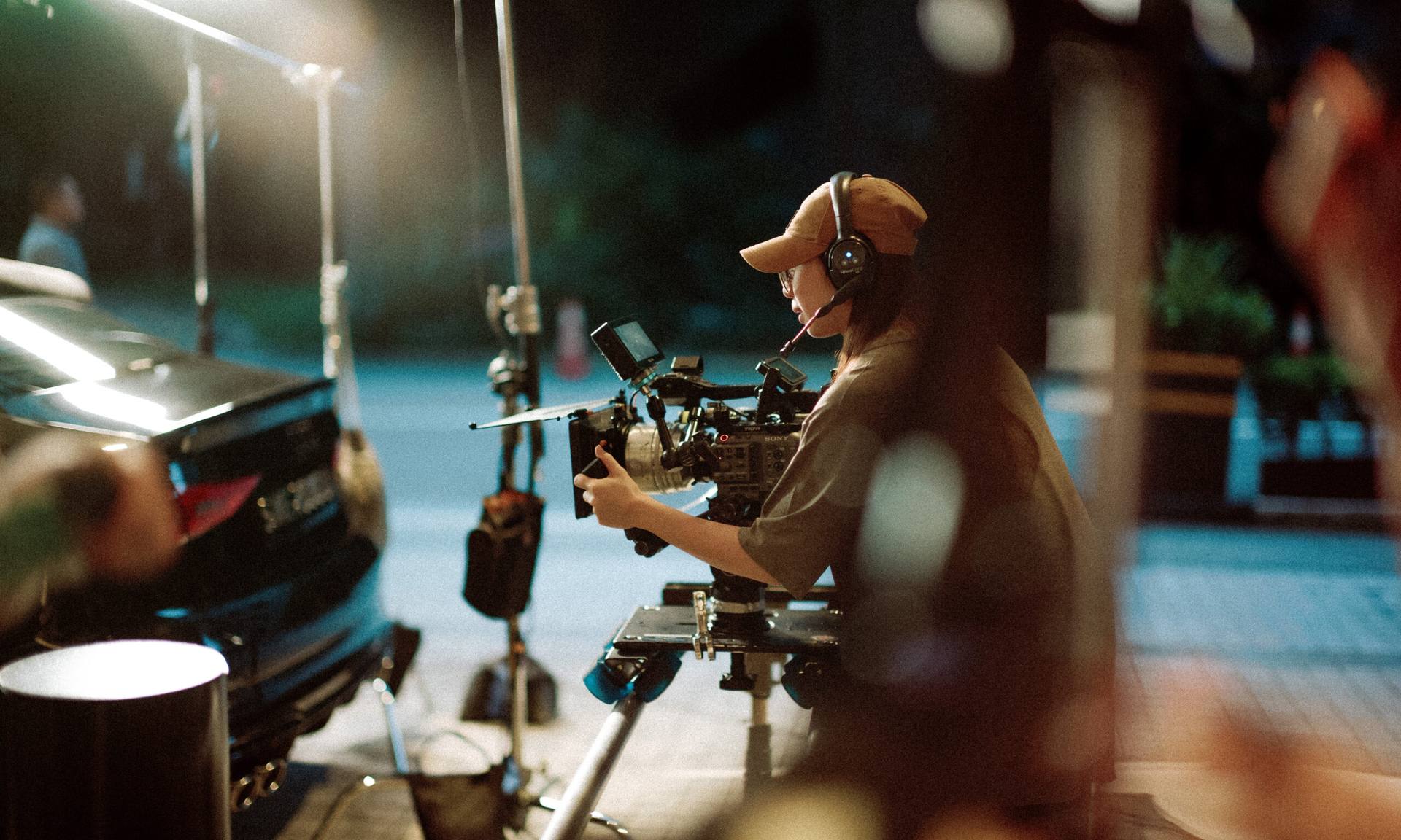 Vicinity Studio camera operator filming a travel video at night