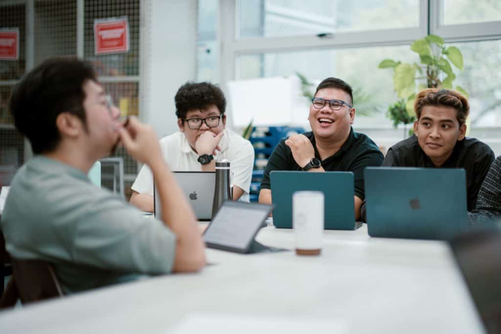 VICINITY's producers gathered with laptops.